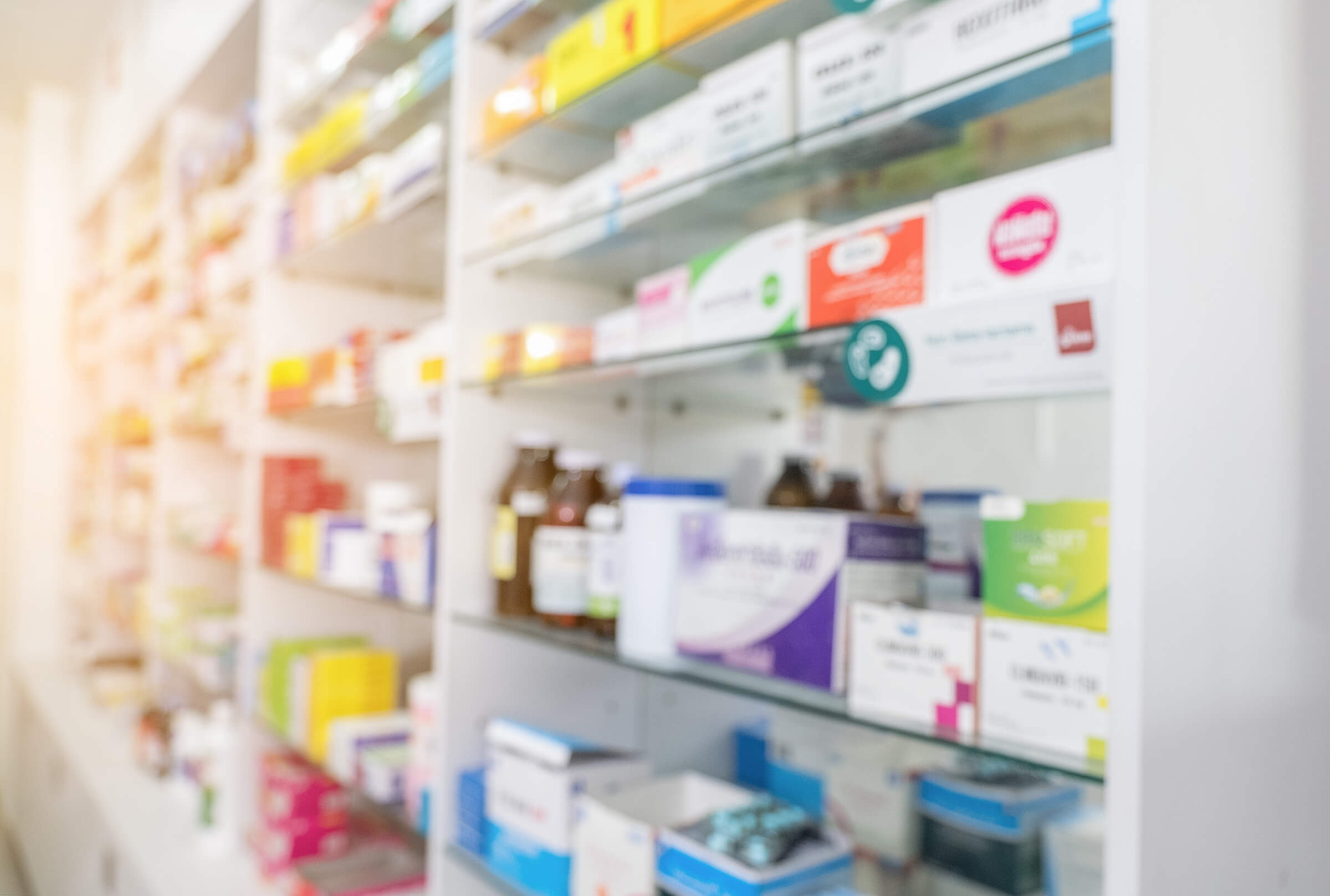 blurry-view-of-drug-store-and-pharmacist-2024-11-28-06-00-44-utc (1)